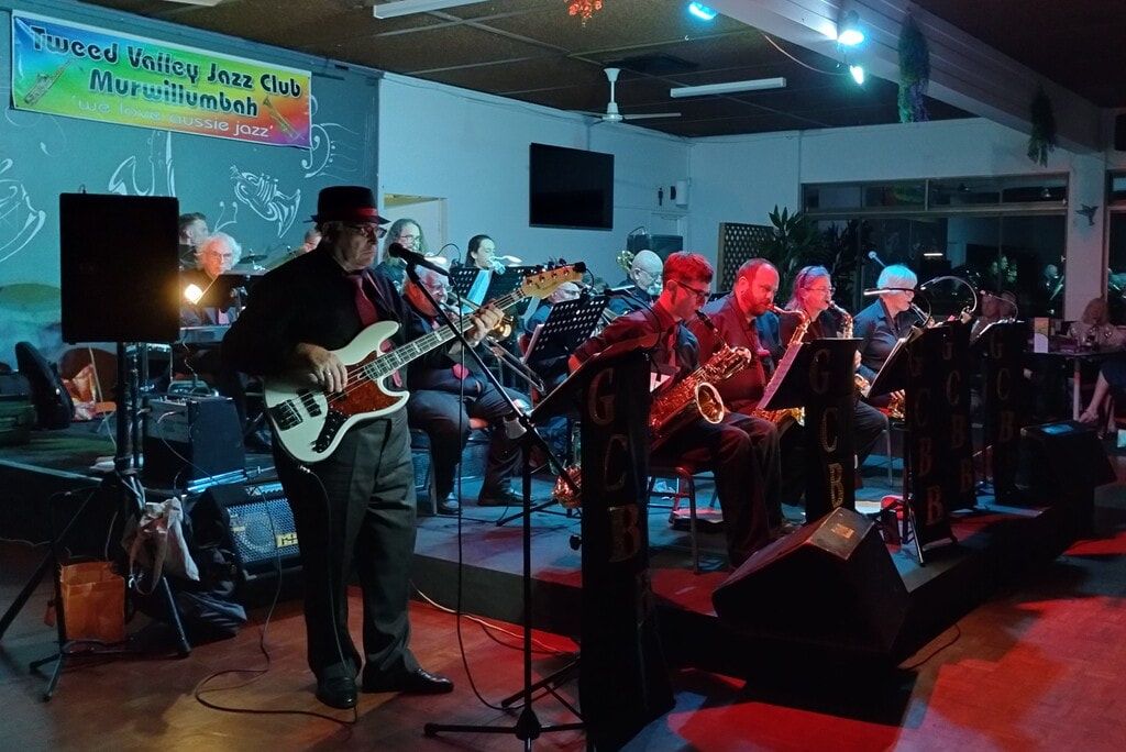 Gold Coast Big Band on stage with the bass player out front and the sax section behind